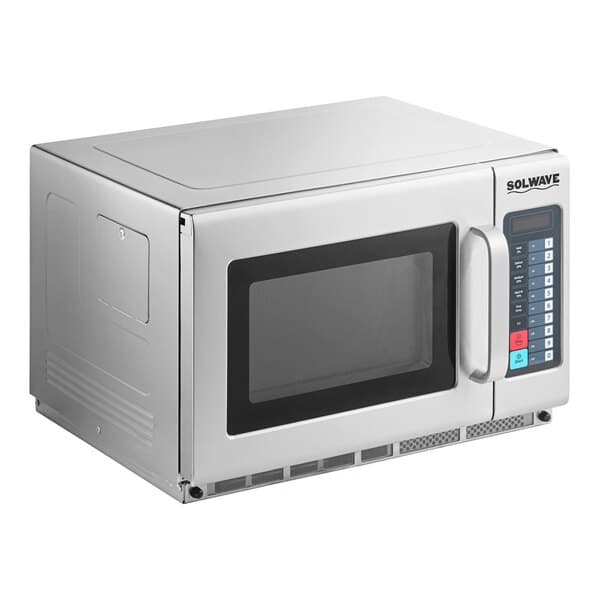 A silver Solwave commercial microwave oven with a door and buttons.